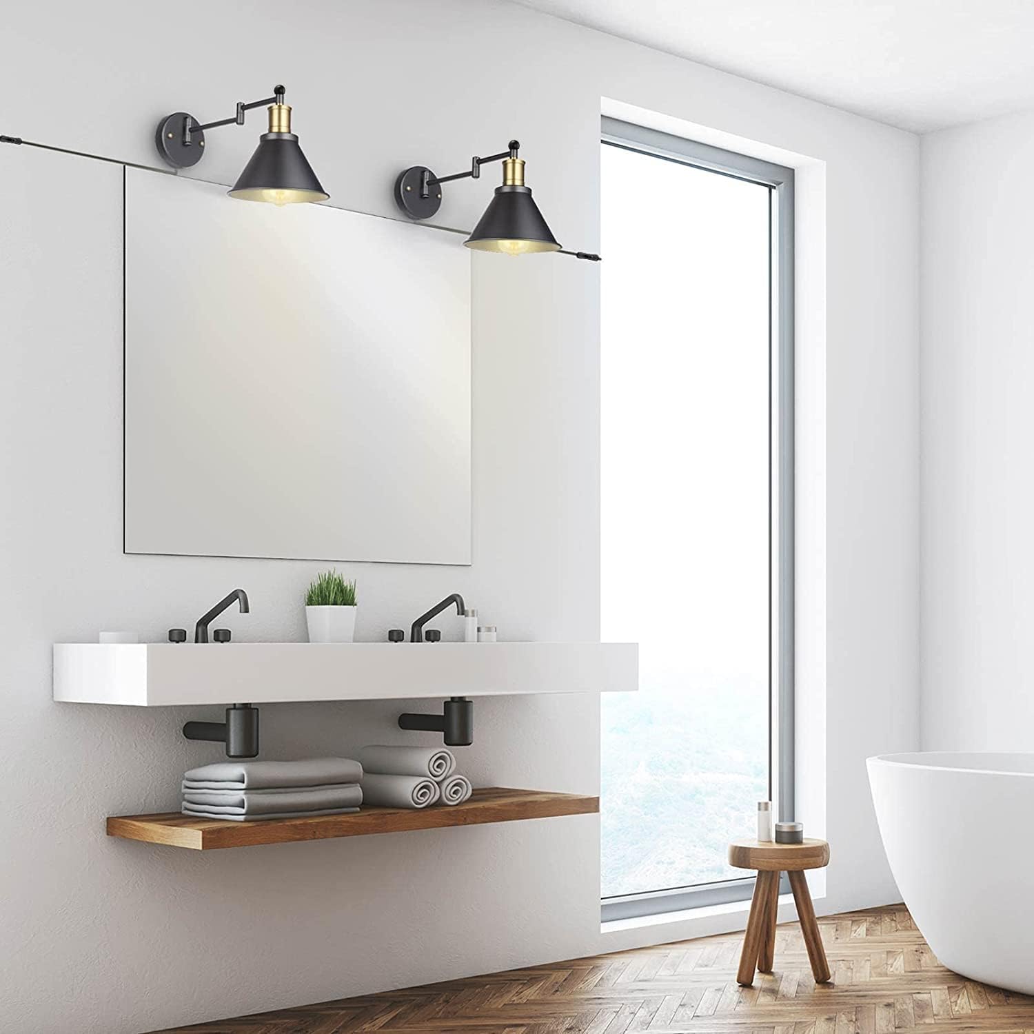 Modern bathroom with white vanity, mirror, and bathtub.