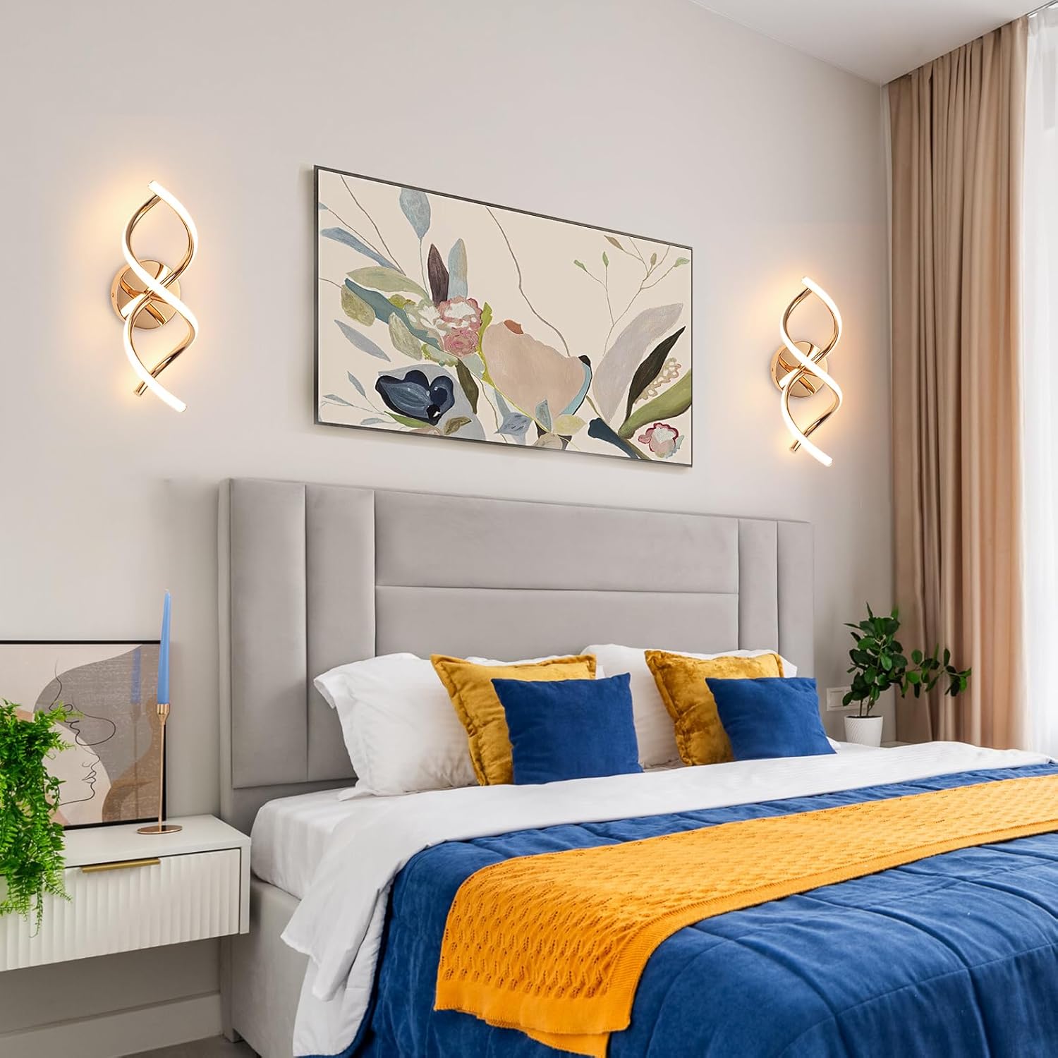 Modern bedroom with a bed, decorative pillows, and wall art.