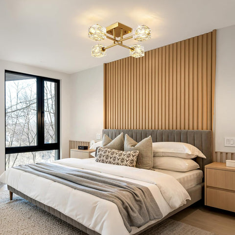 Modern bedroom with a bed, nightstands, and decorative pillows.
