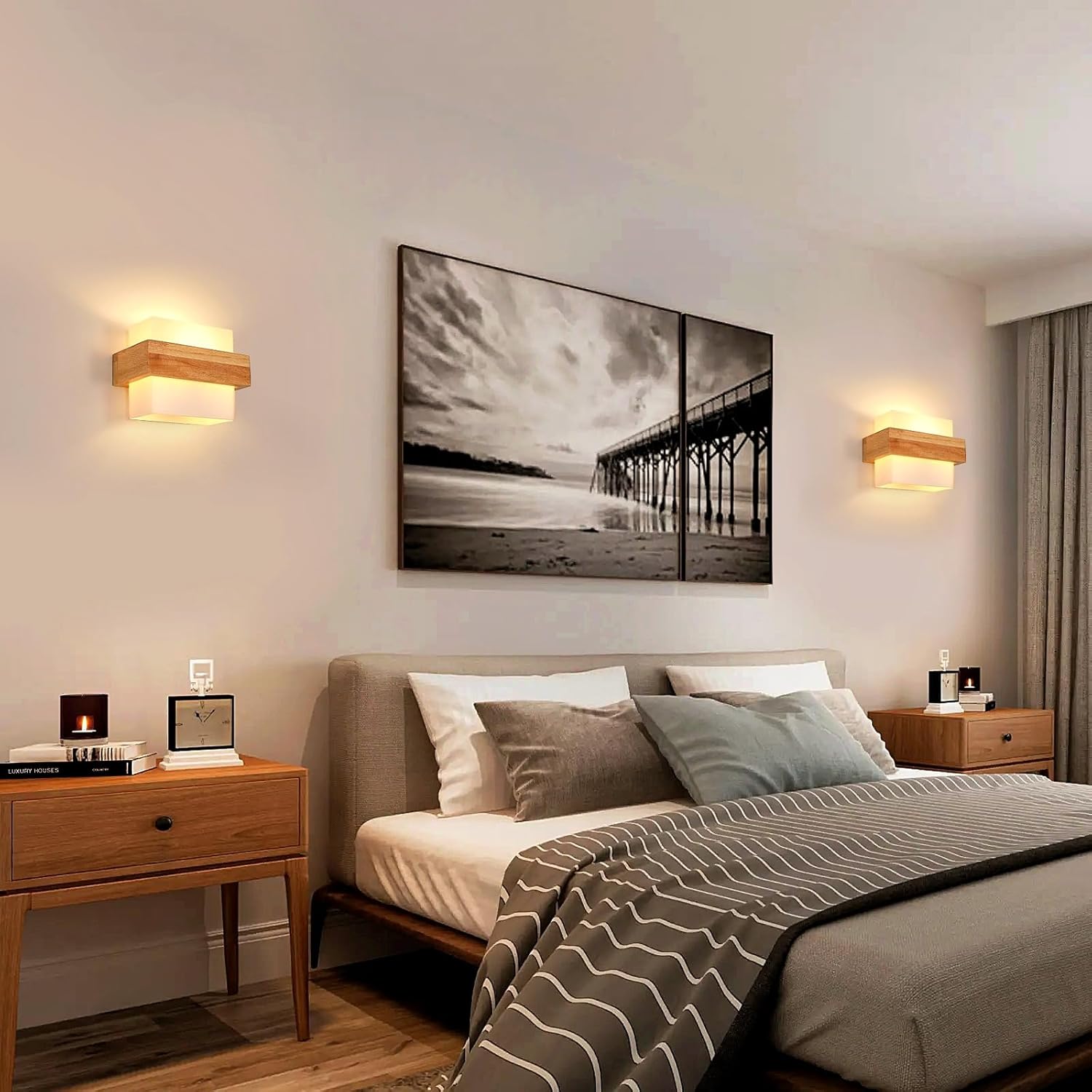Modern bedroom with a bed, nightstands, and wall art depicting a beach scene.