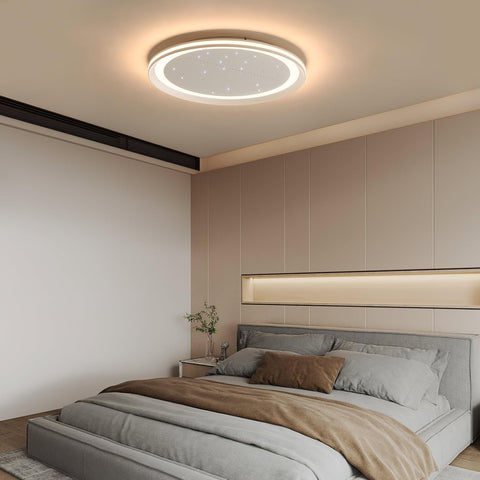Modern bedroom with a ceiling light fixture and neatly made bed.