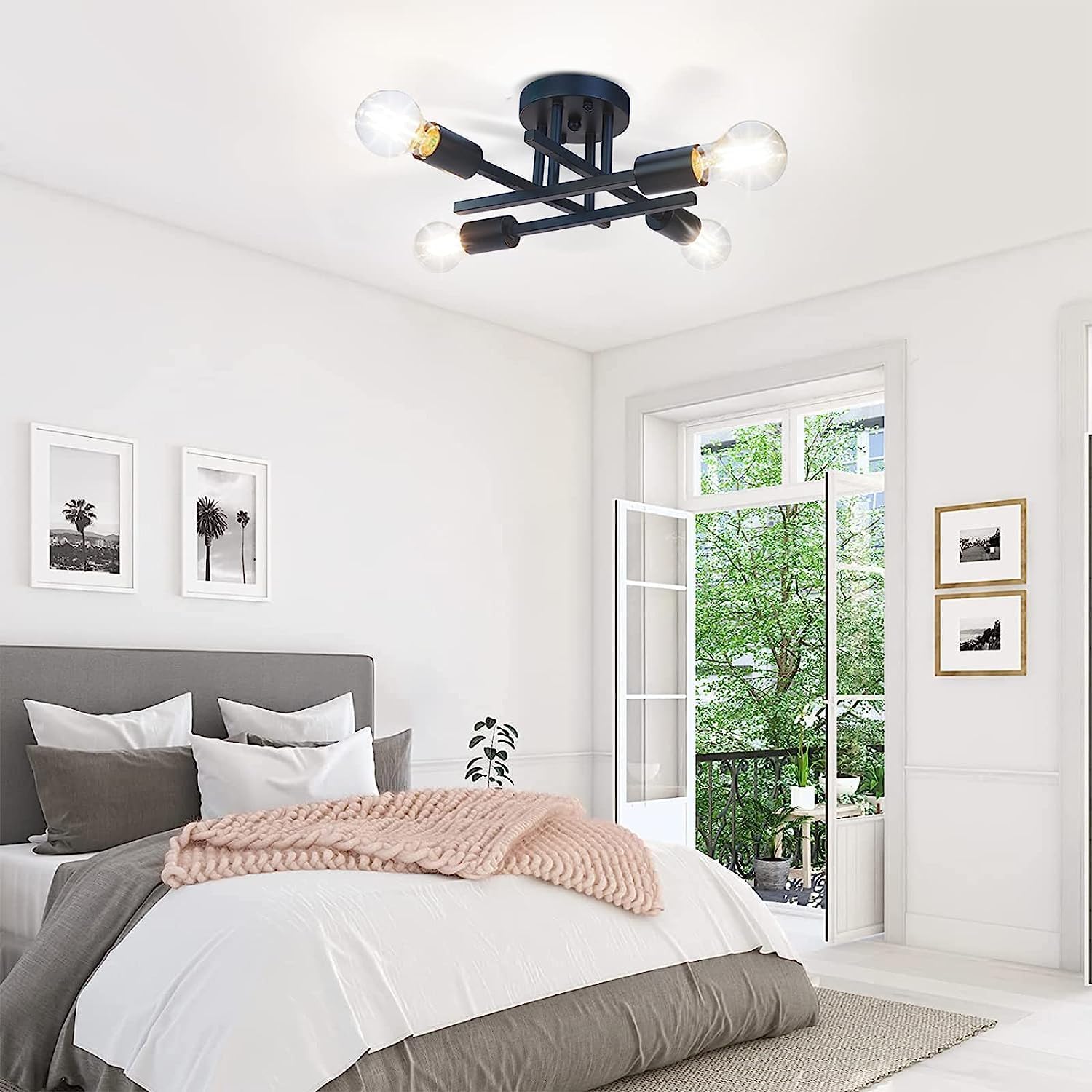 Modern bedroom with a ceiling light fixture, bed, and open door leading to a balcony.