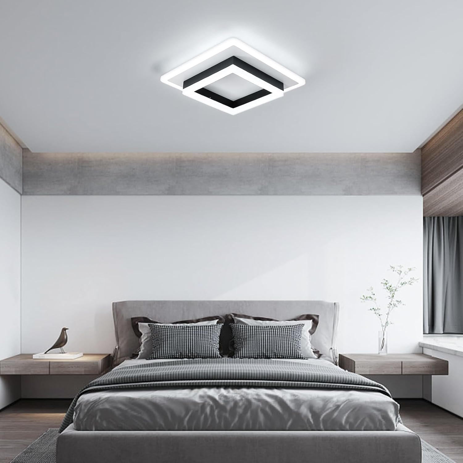 Modern bedroom with a ceiling light fixture, bed, and side tables.
