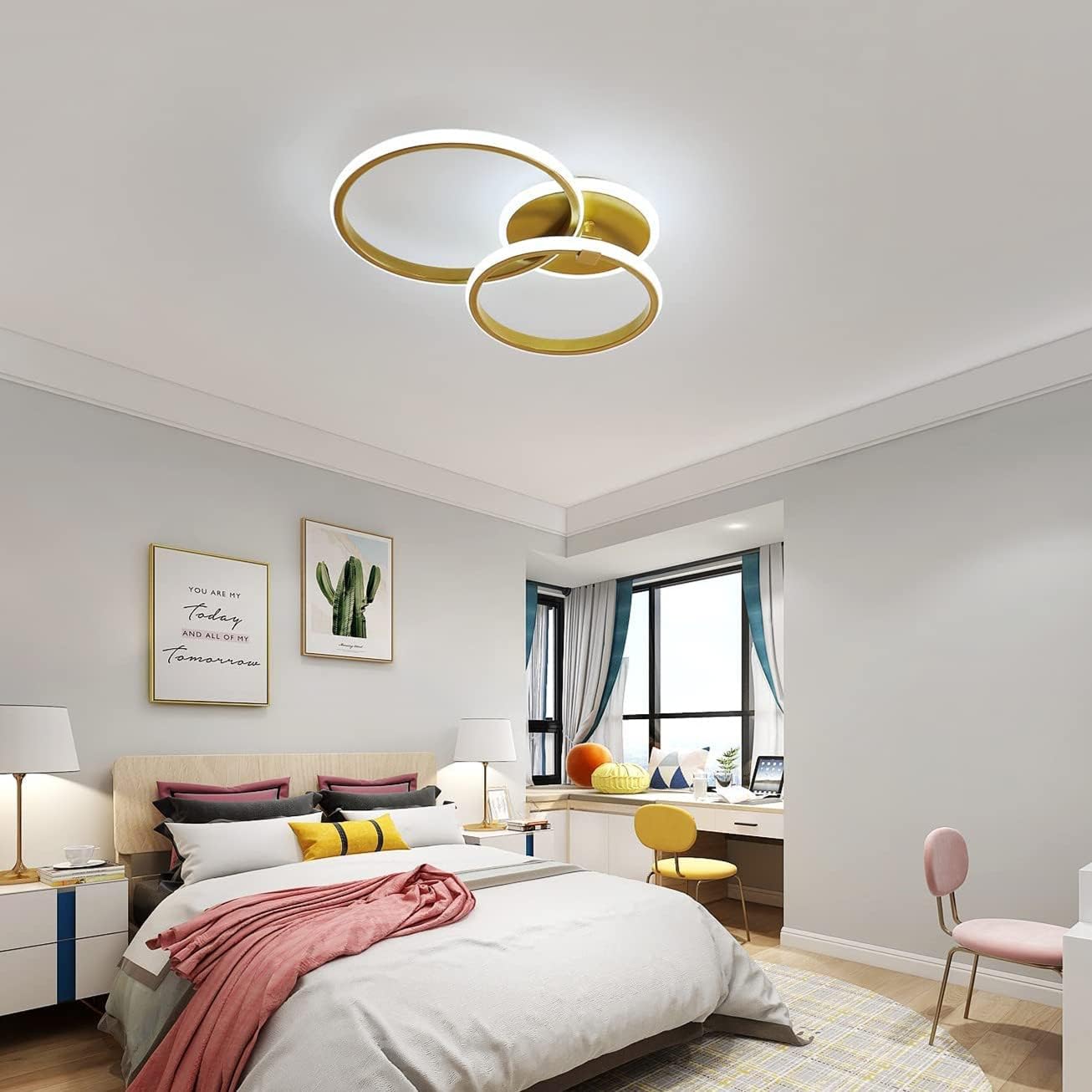 Modern bedroom with a ceiling light fixture, bed, desk, and decor.