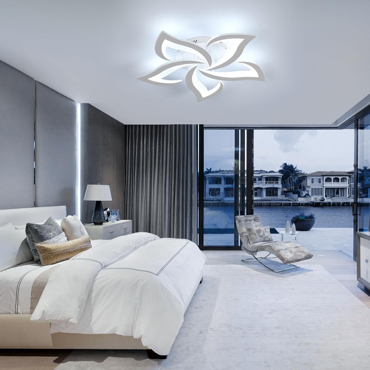 Modern bedroom with a decorative ceiling light fixture.