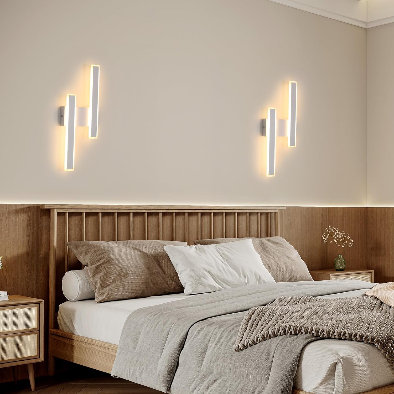 Modern bedroom with wooden bed, wall lights, and neutral decor.