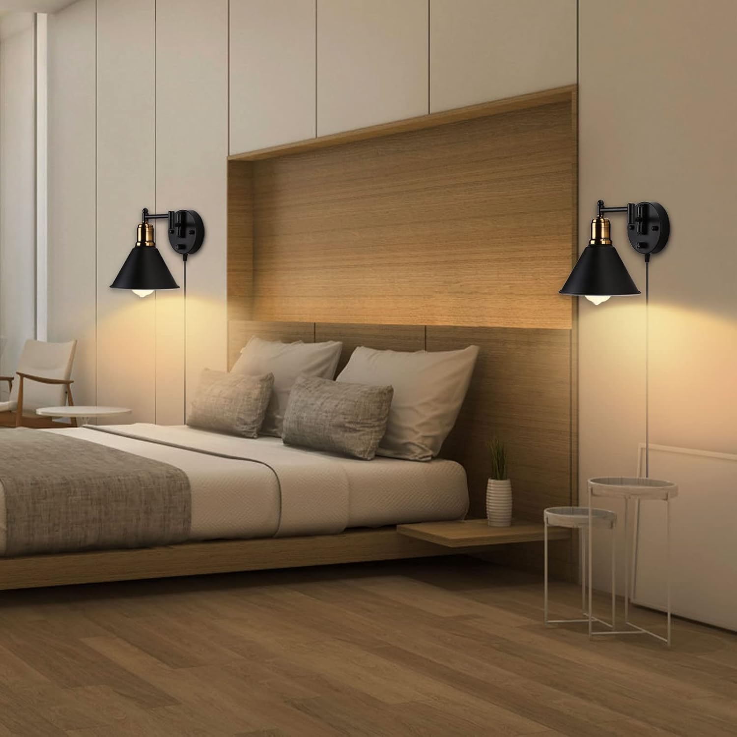Modern bedroom with wooden headboard, bed, and wall sconces.