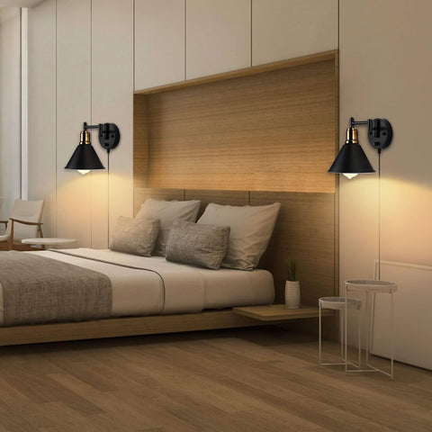 Modern bedroom with wooden headboard, bed, and wall sconces.