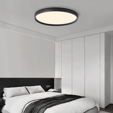 Modern bedroom with a ceiling light fixture