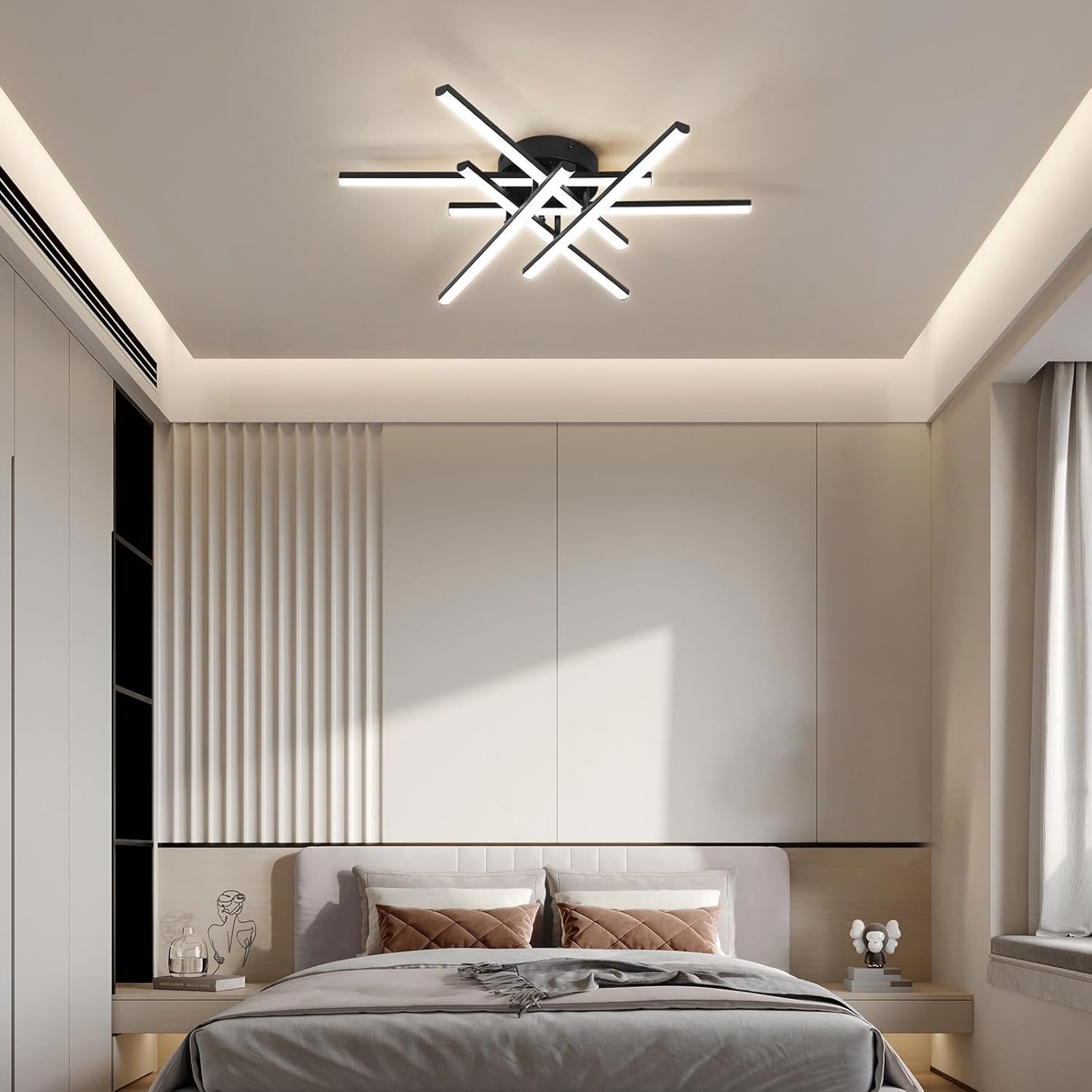 Modern bedroom with a ceiling light fixture and neatly made bed.
