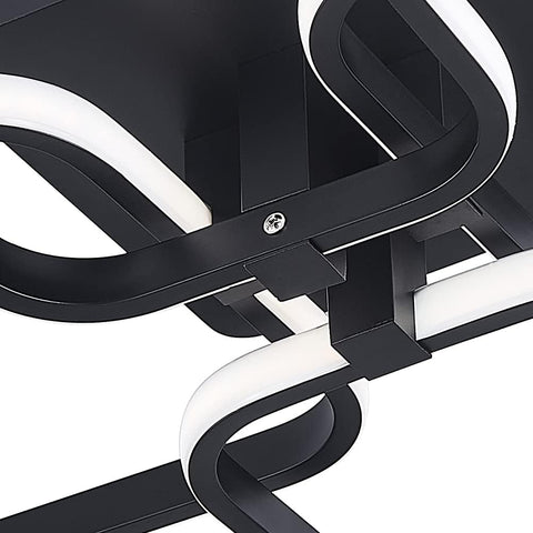 Modern black and white ceiling light fixture on a white background