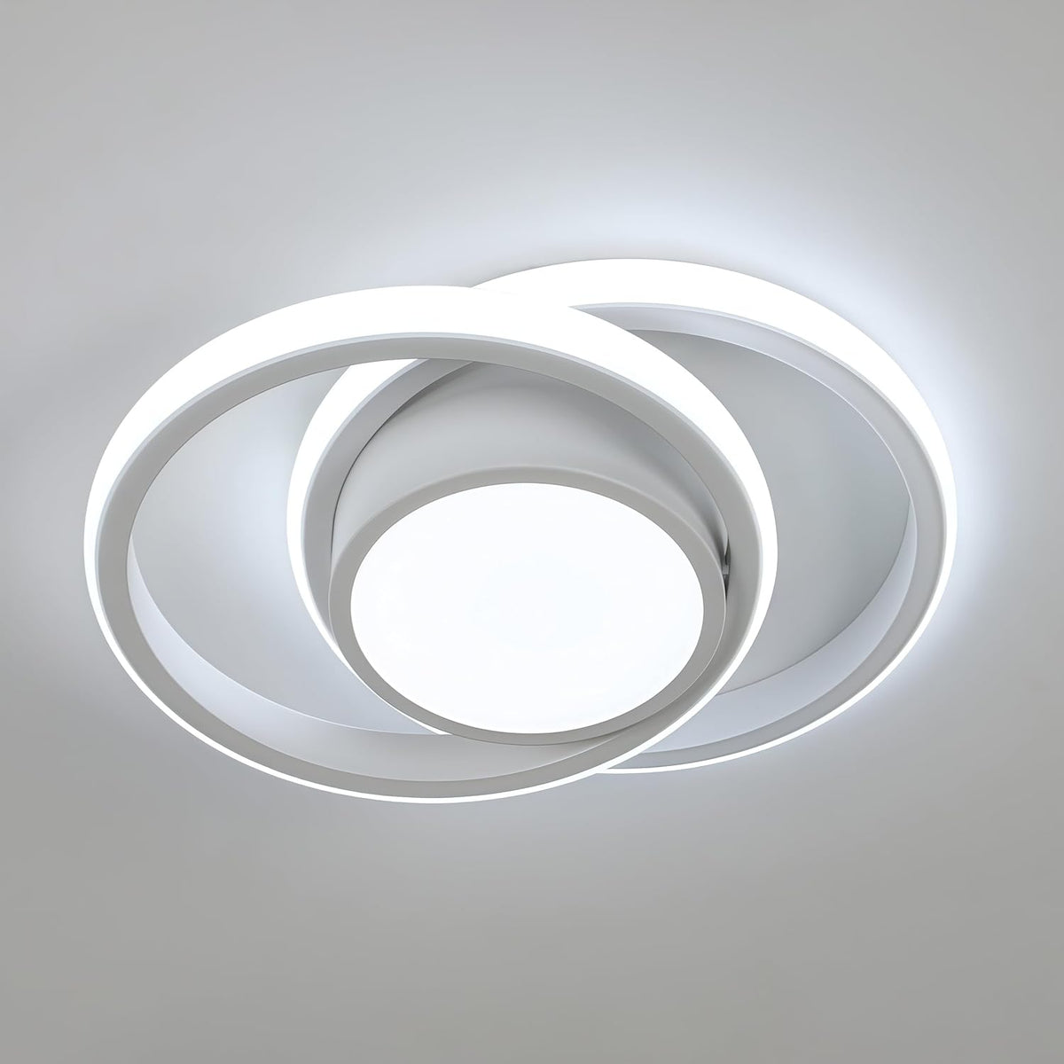 Modern ceiling light fixture with circular design on a neutral background