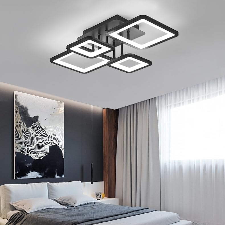Modern ceiling light fixture in a bedroom setting with a bed and wall art.