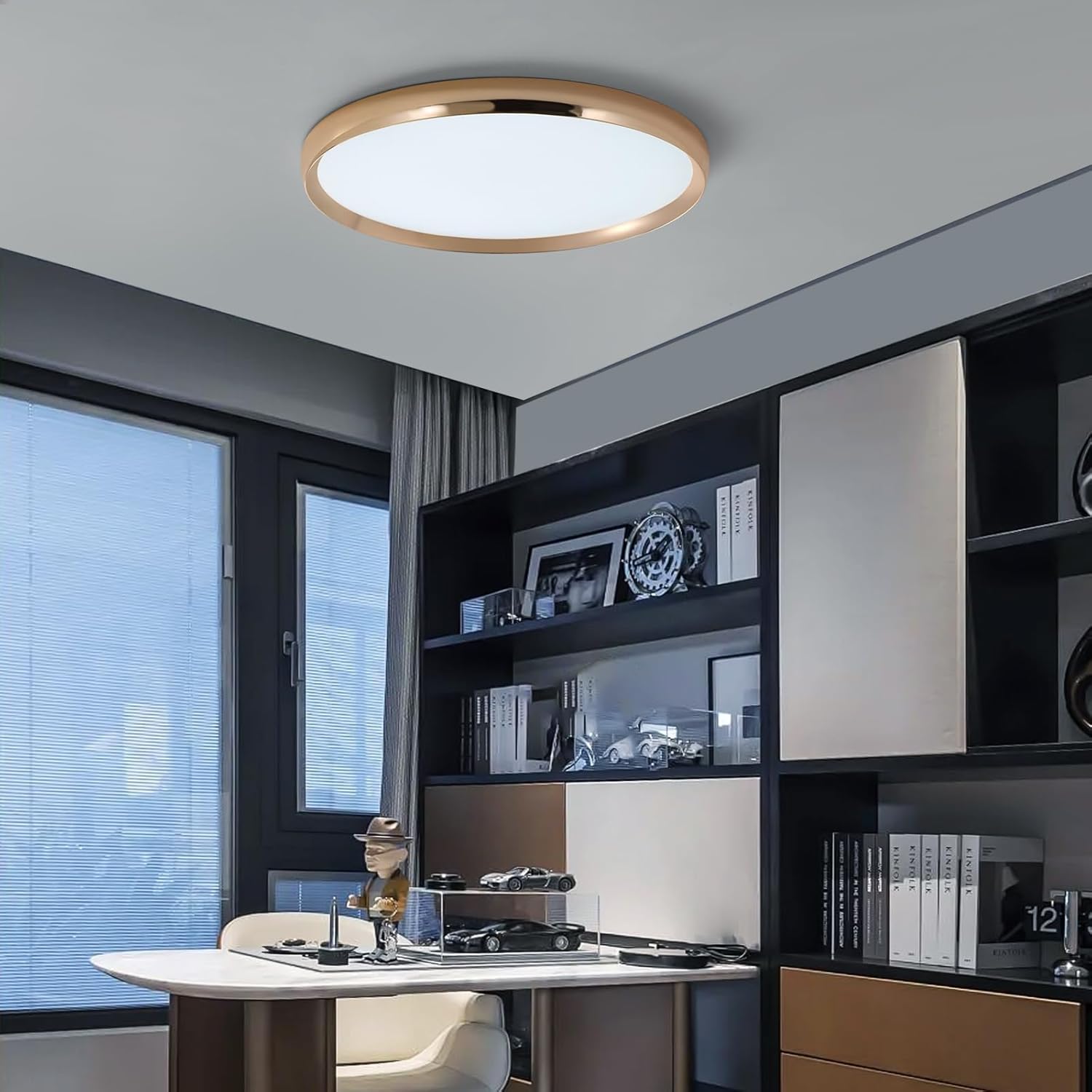 Modern ceiling light fixture in a room with shelves and a window.