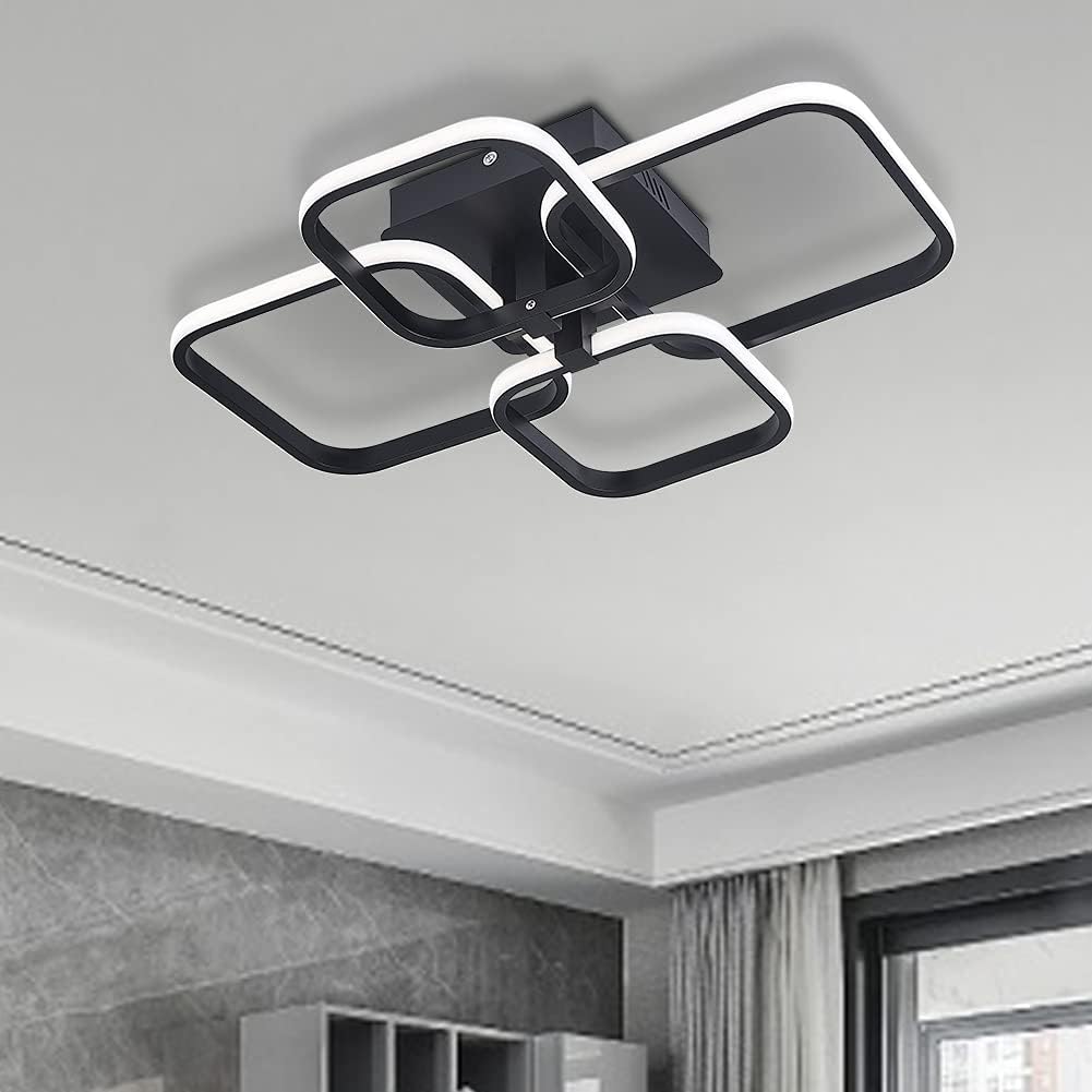 Modern ceiling light fixture in a room with gray walls and a window.