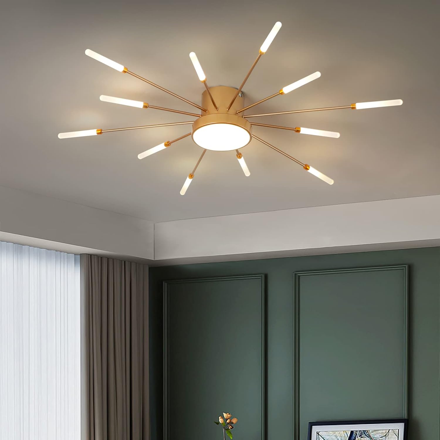 Modern ceiling light fixture in a room with green walls and a window.