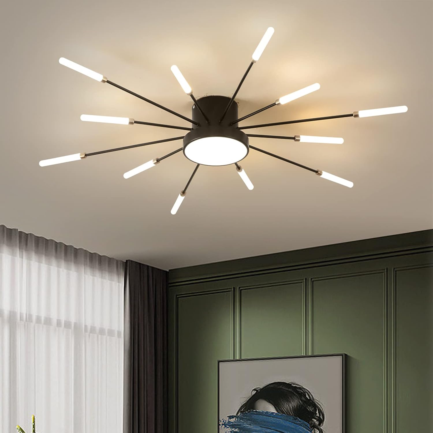 Modern ceiling light fixture in a room with green walls and white curtains.