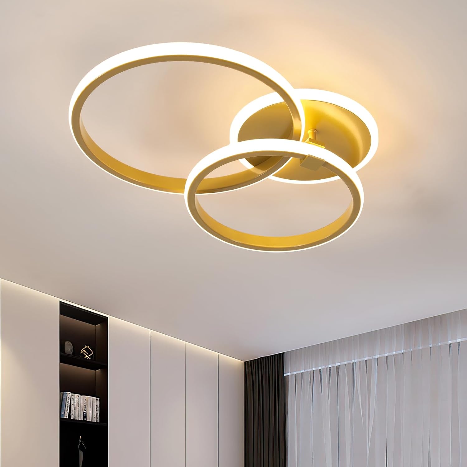 Modern ceiling light fixture with three circular rings on a ceiling.