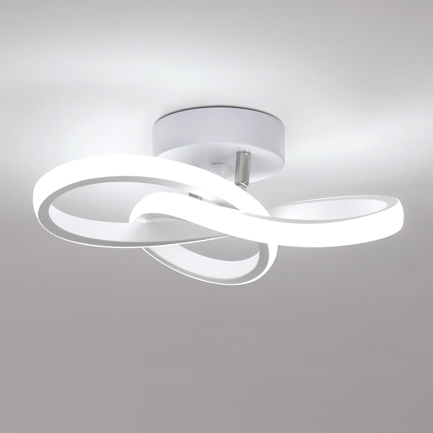 Modern ceiling light fixture with three circular shades on a gray background