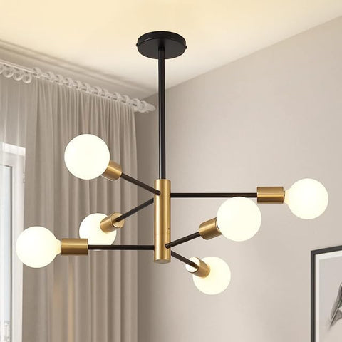 Modern chandelier with gold and black design in a room setting