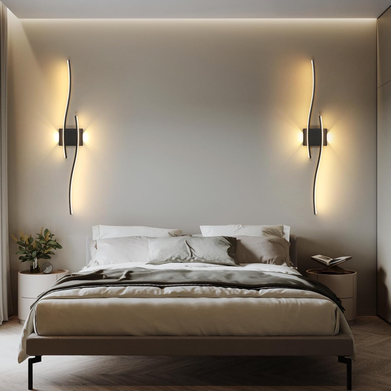 Modern bedroom with a bed, nightstands, and wall sconces.