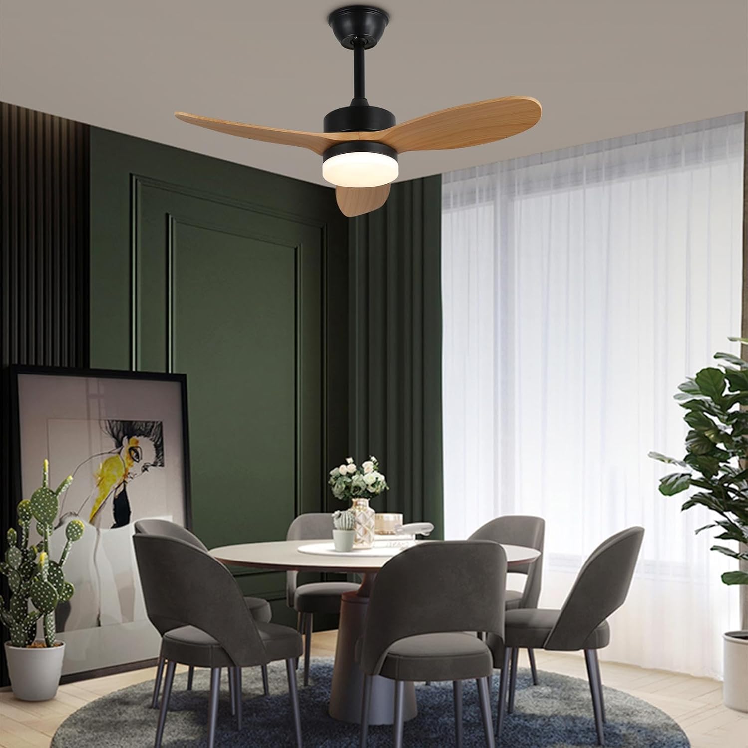 Modern dining room with a ceiling fan, table, and chairs.