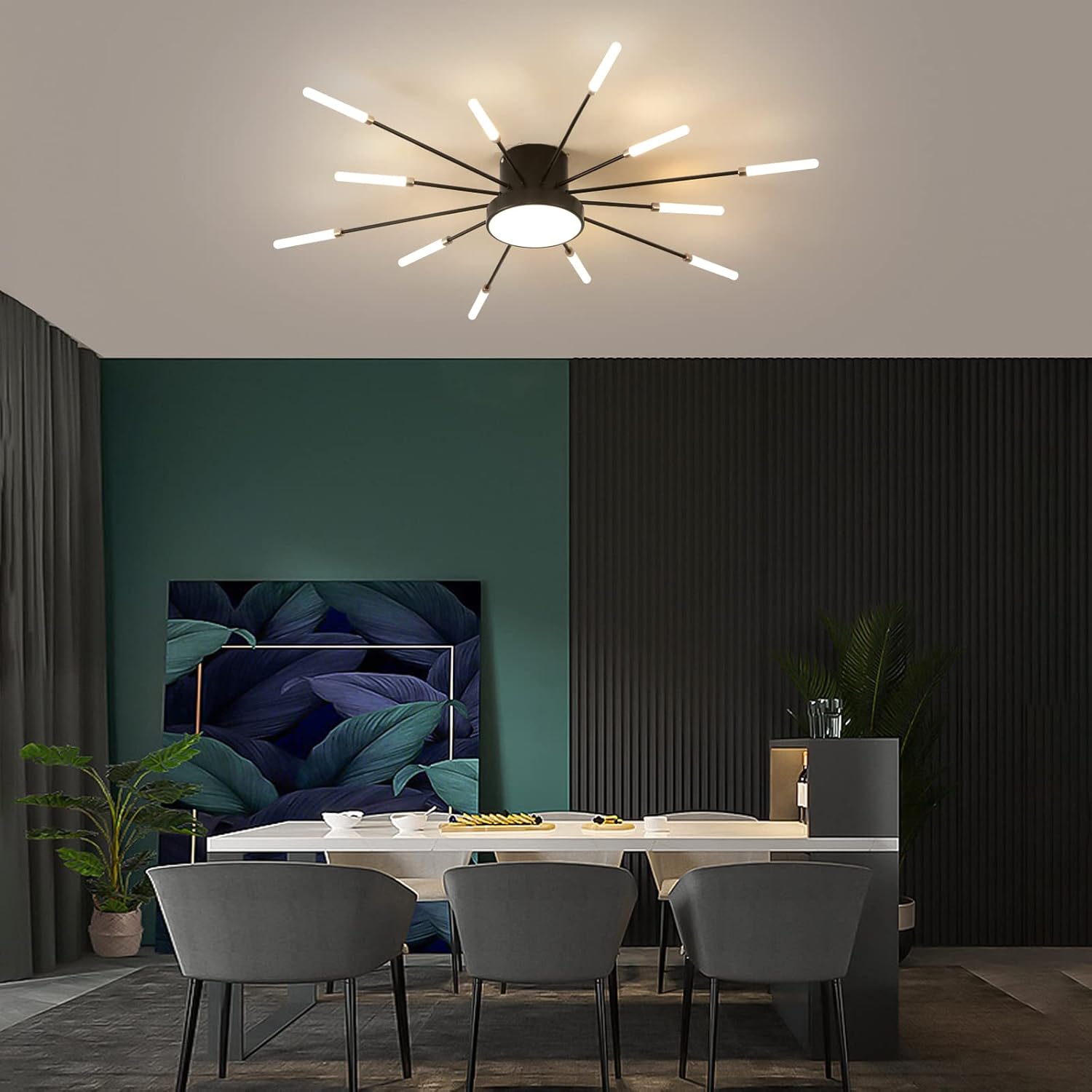 Modern dining room with a stylish ceiling light fixture, table, and chairs.