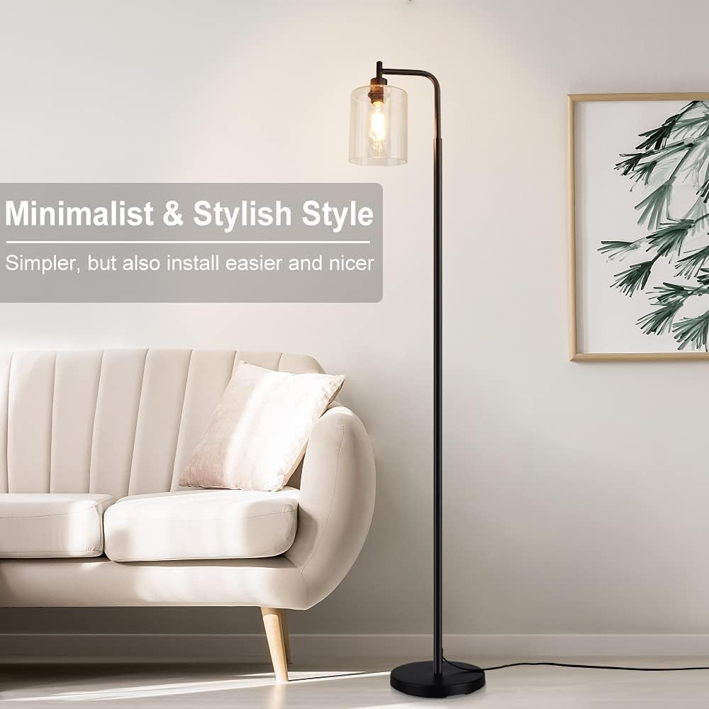 Modern floor lamp in a living room setting with a sofa and decorative wall art.