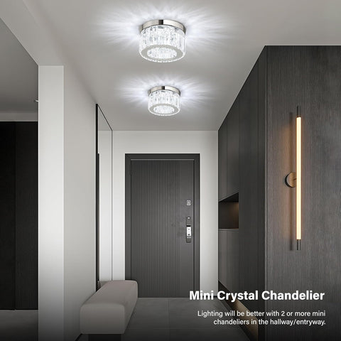 Modern hallway with ceiling lights and wall sconce, featuring a mini crystal chandelier.