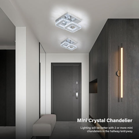 Modern hallway with ceiling lights and wall sconce, featuring a mini crystal chandelier.