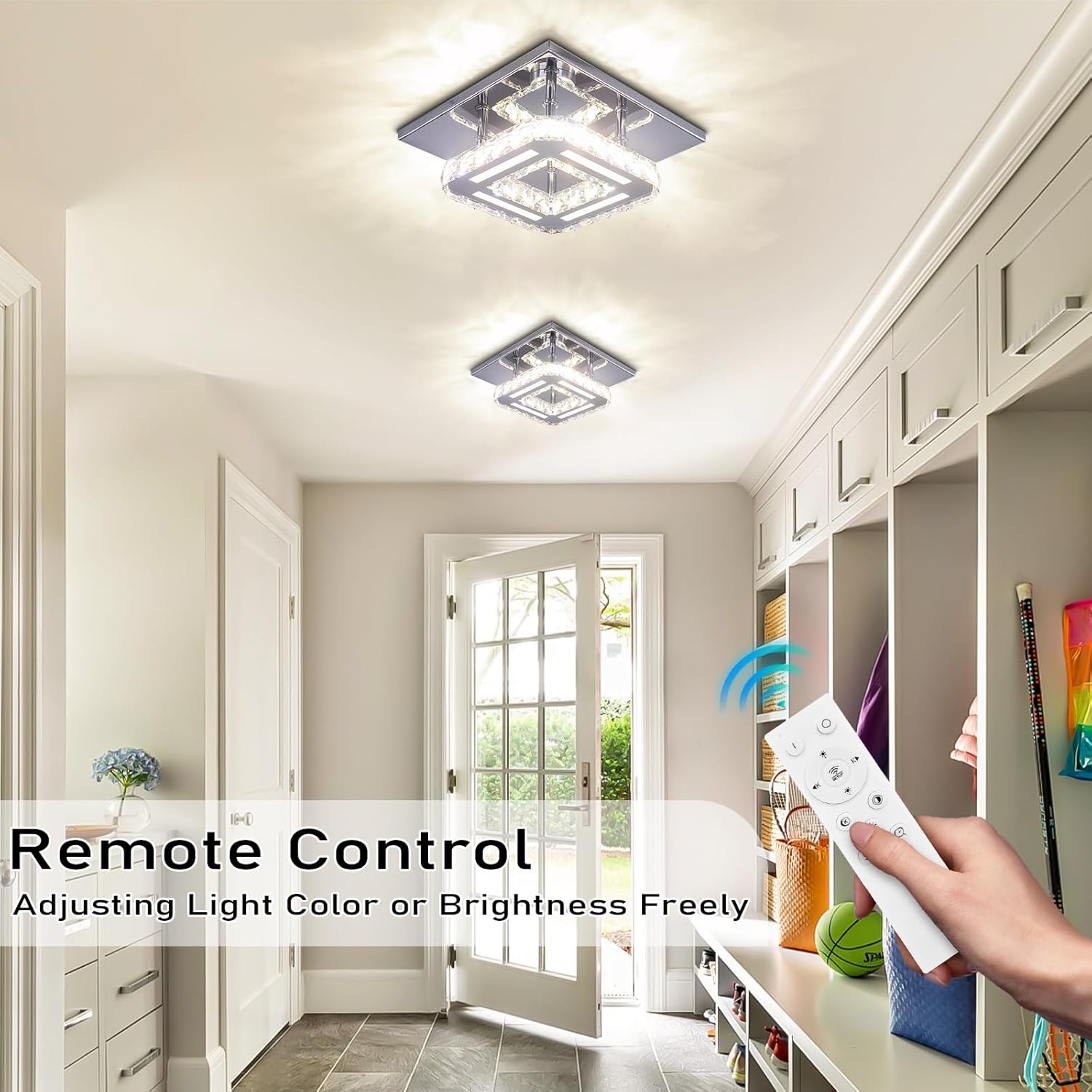 Modern home interior with ceiling lights and a hand holding a remote control.