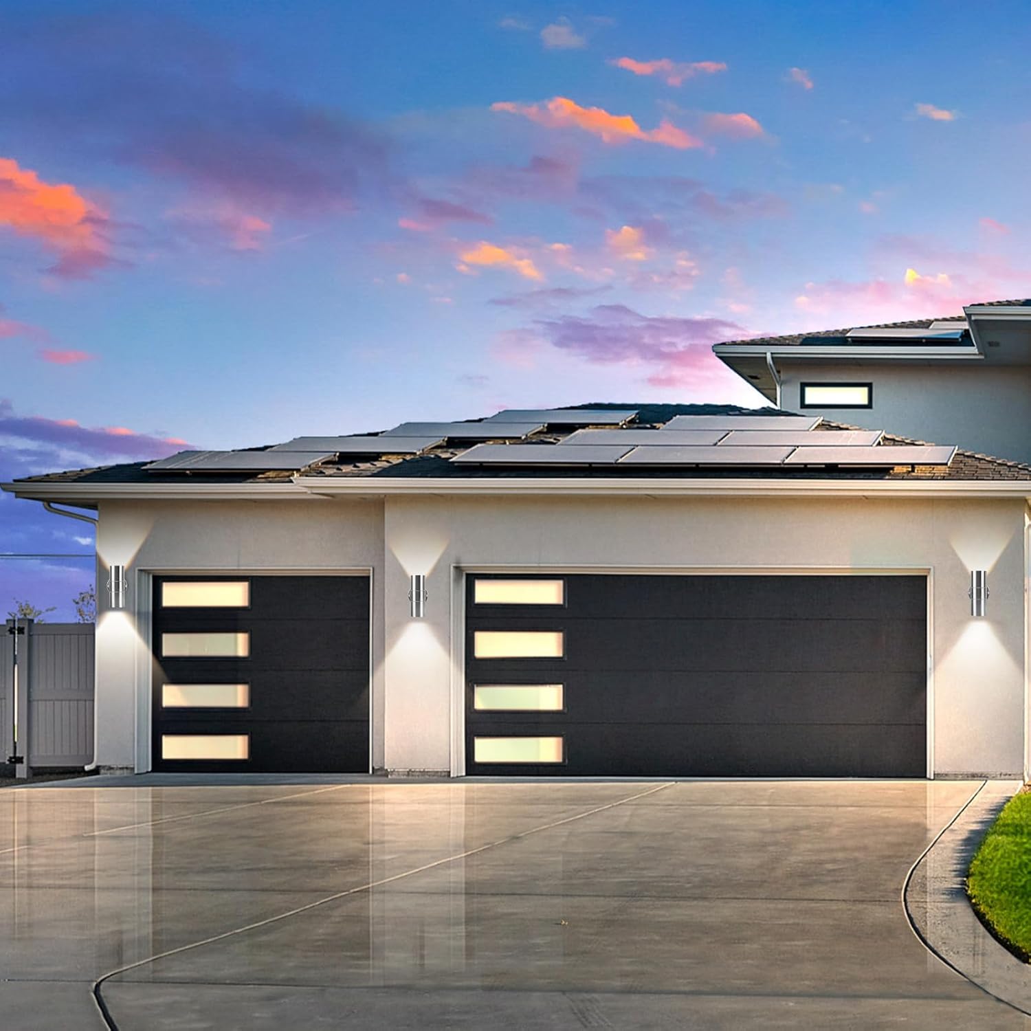 Modern house with solar panels on the roof during sunset