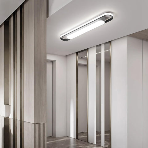 Modern interior design with a ceiling light fixture in a hallway.
