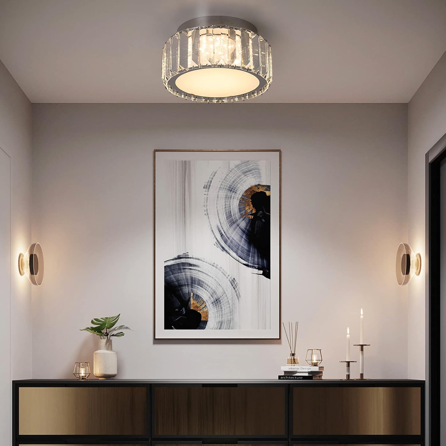 Modern interior design with a ceiling light fixture, wall art, and decorative items.