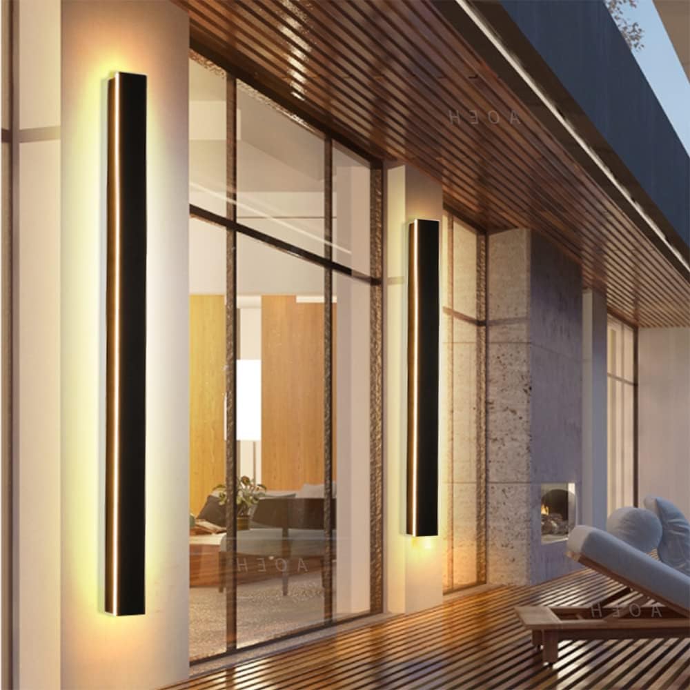 Modern interior design with wall-mounted lights and a glass door.