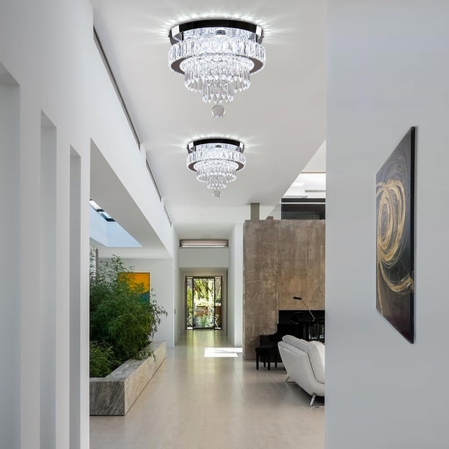 Modern interior with chandelier, artwork, and furniture
