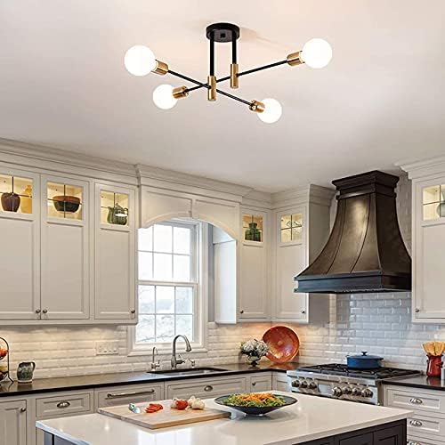 Modern kitchen with a ceiling light fixture, white cabinets, and a stovetop.