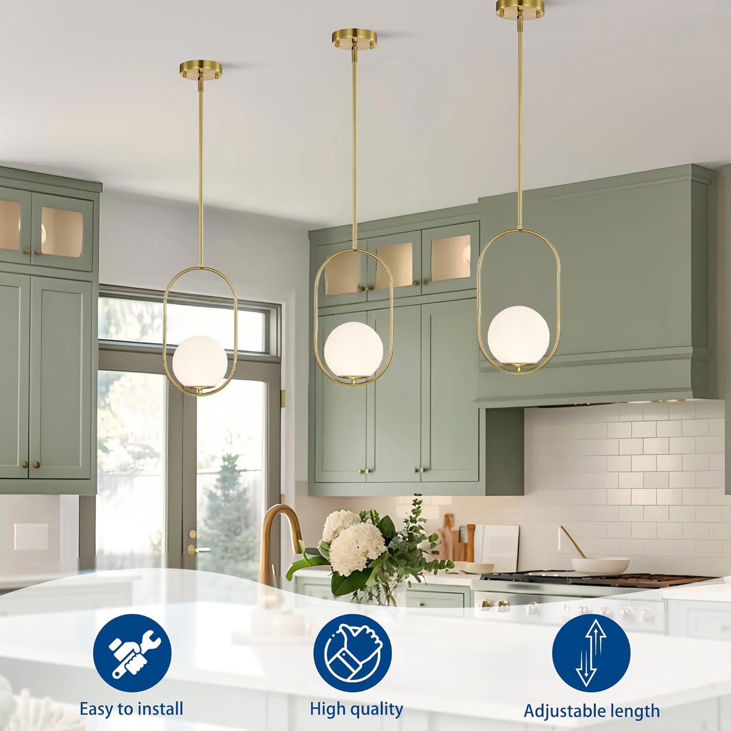 Modern kitchen with pendant lights, green cabinets, and a white countertop.