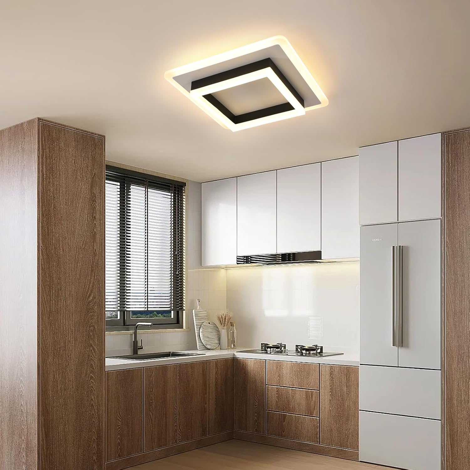 Modern kitchen with wooden cabinets, white appliances, and a ceiling light fixture.