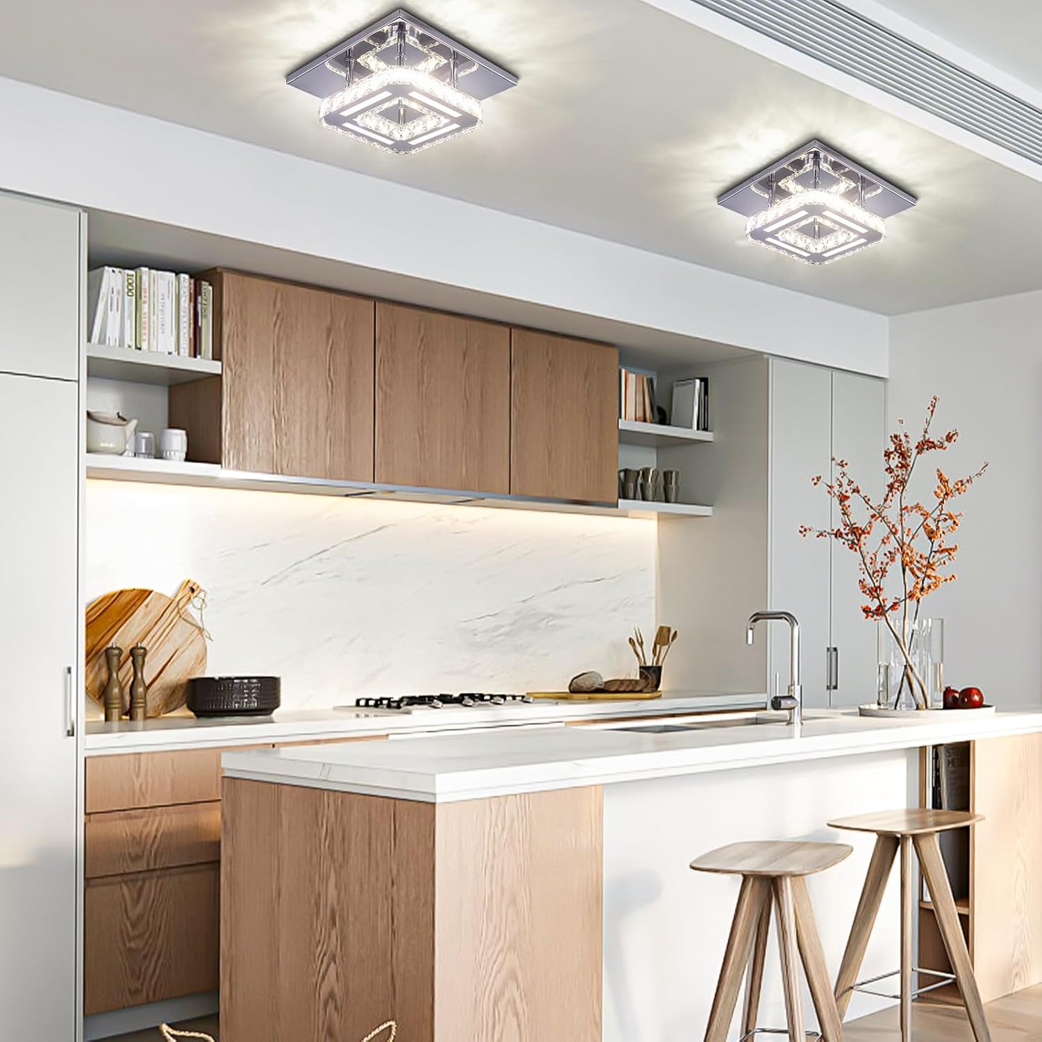 Modern kitchen with wooden cabinets, white countertops, and decorative elements.