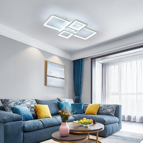Modern living room with a blue sofa, decorative pillows, and a ceiling light fixture.