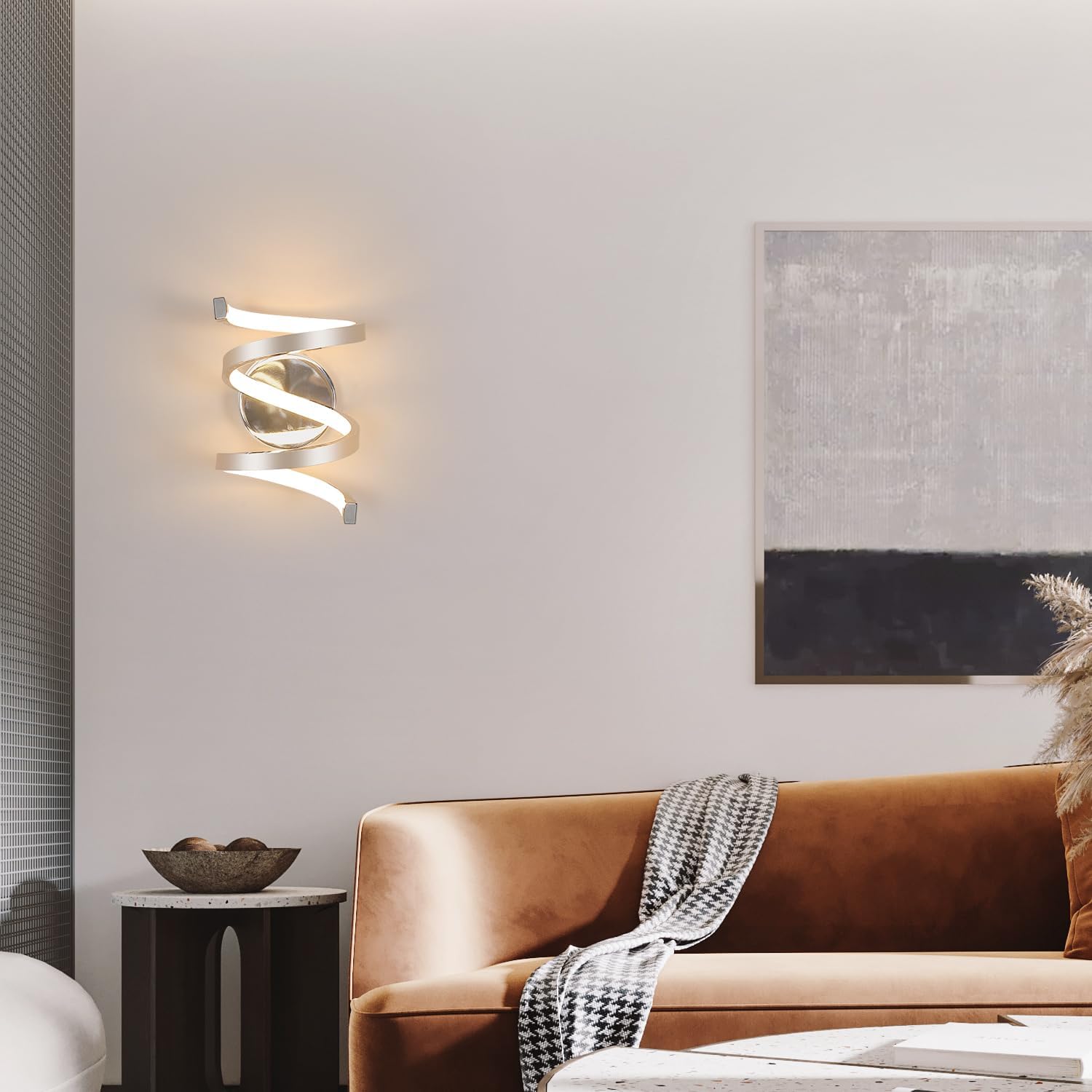 Modern living room with a brown sofa, side table, and wall light fixture.