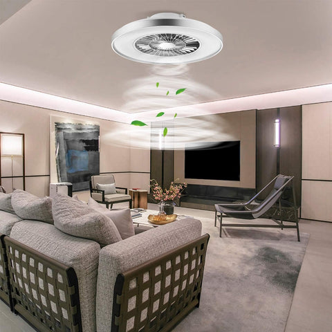 Modern living room with a ceiling fan and decorative elements.