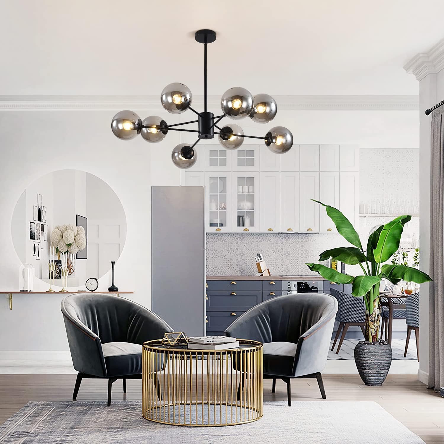 Modern living room with a chandelier, chairs, and a coffee table.