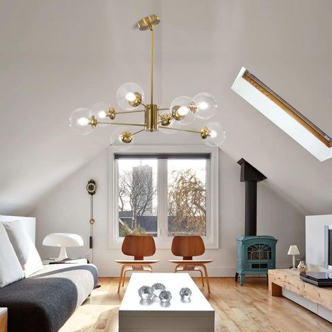 Modern living room with a chandelier, coffee table, and wooden chairs.