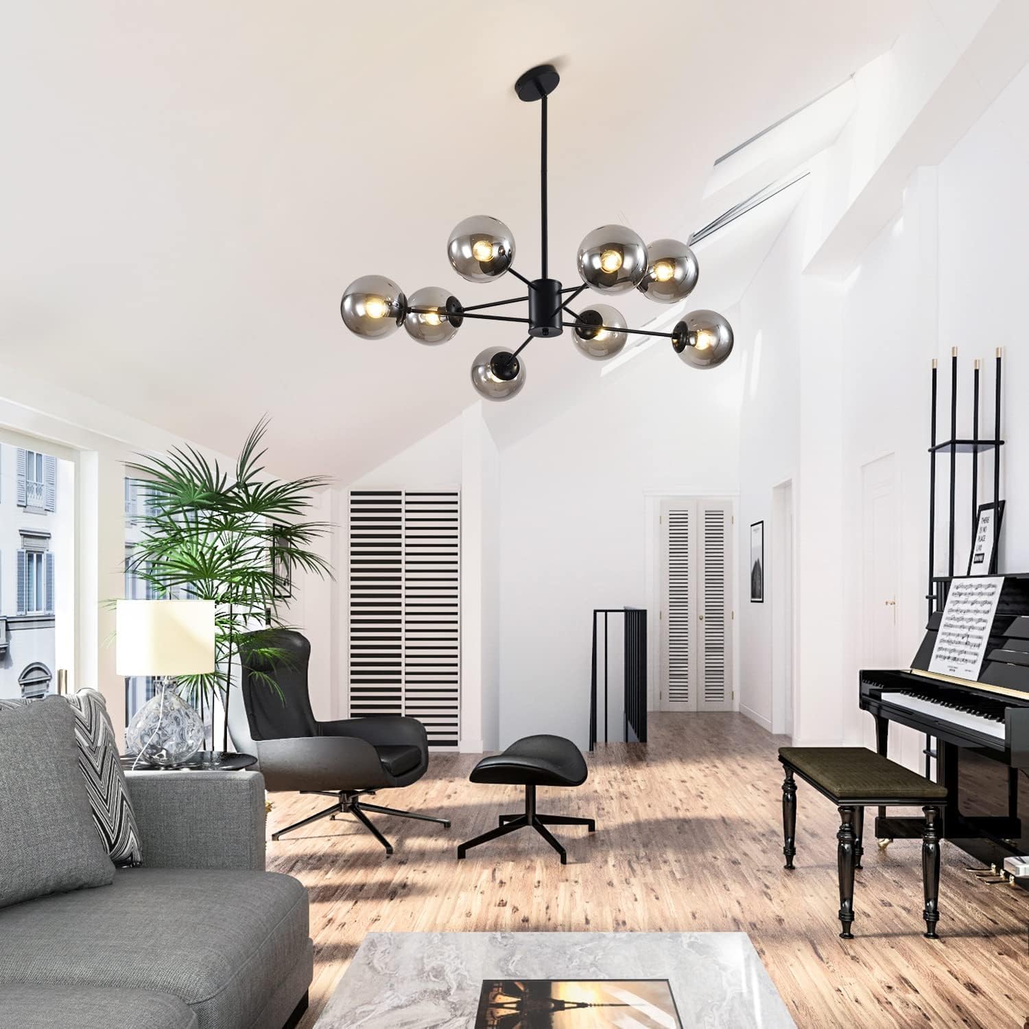Modern living room with a chandelier, gray sofa, and piano.
