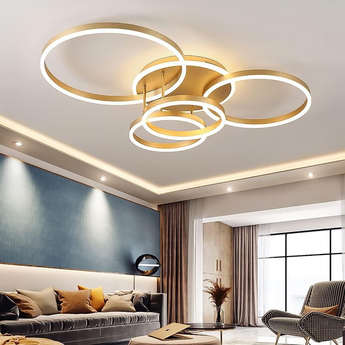 Modern living room with a gold circular ceiling light fixture.