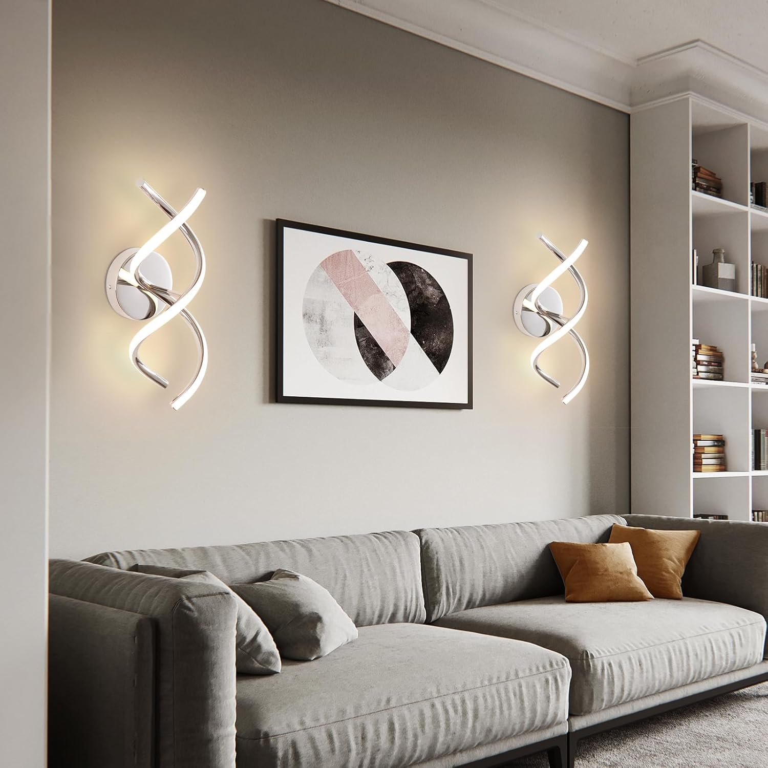 Modern living room with a gray sofa, wall art, and decorative wall lights.