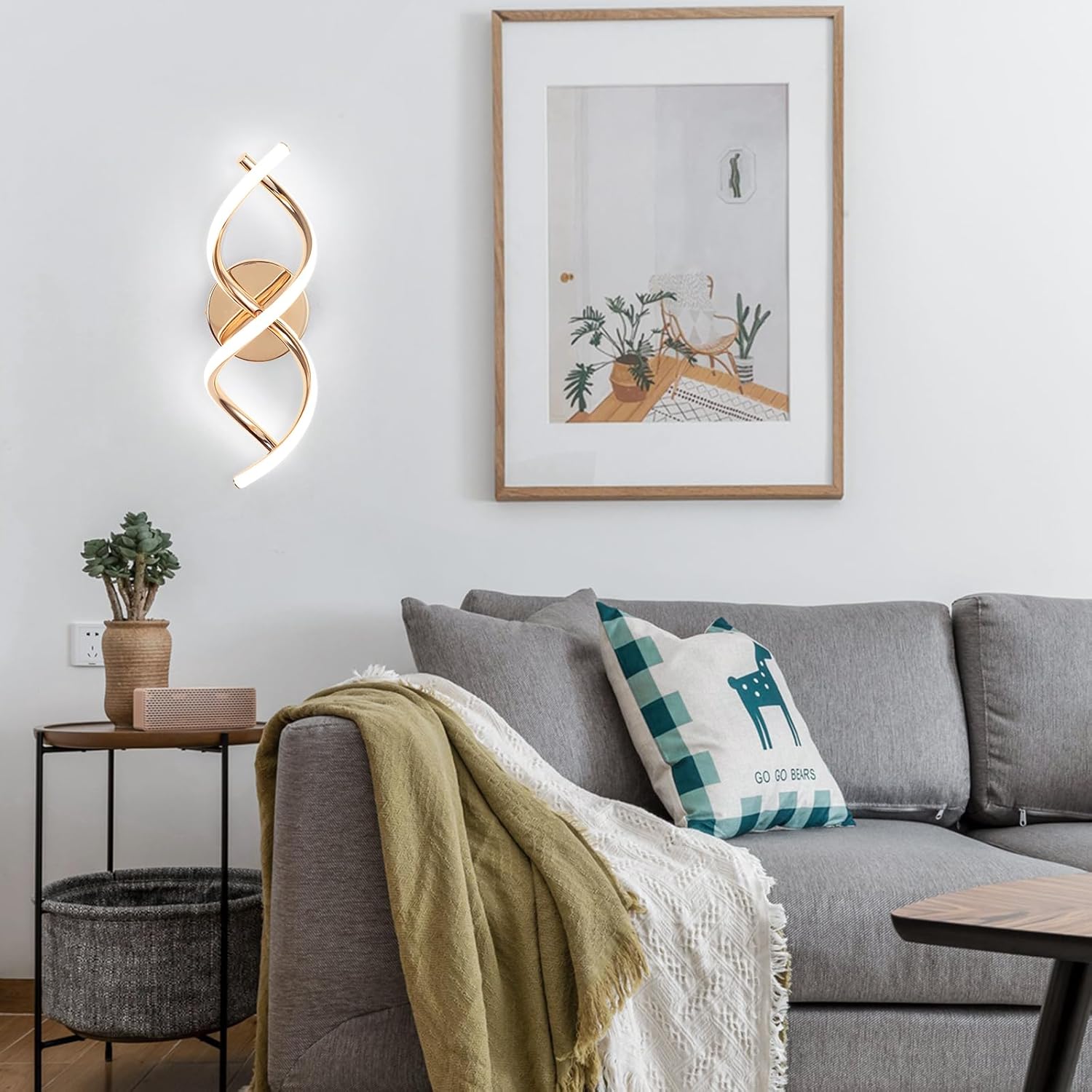 Modern living room with gray sofa, decorative pillows, and wall art.