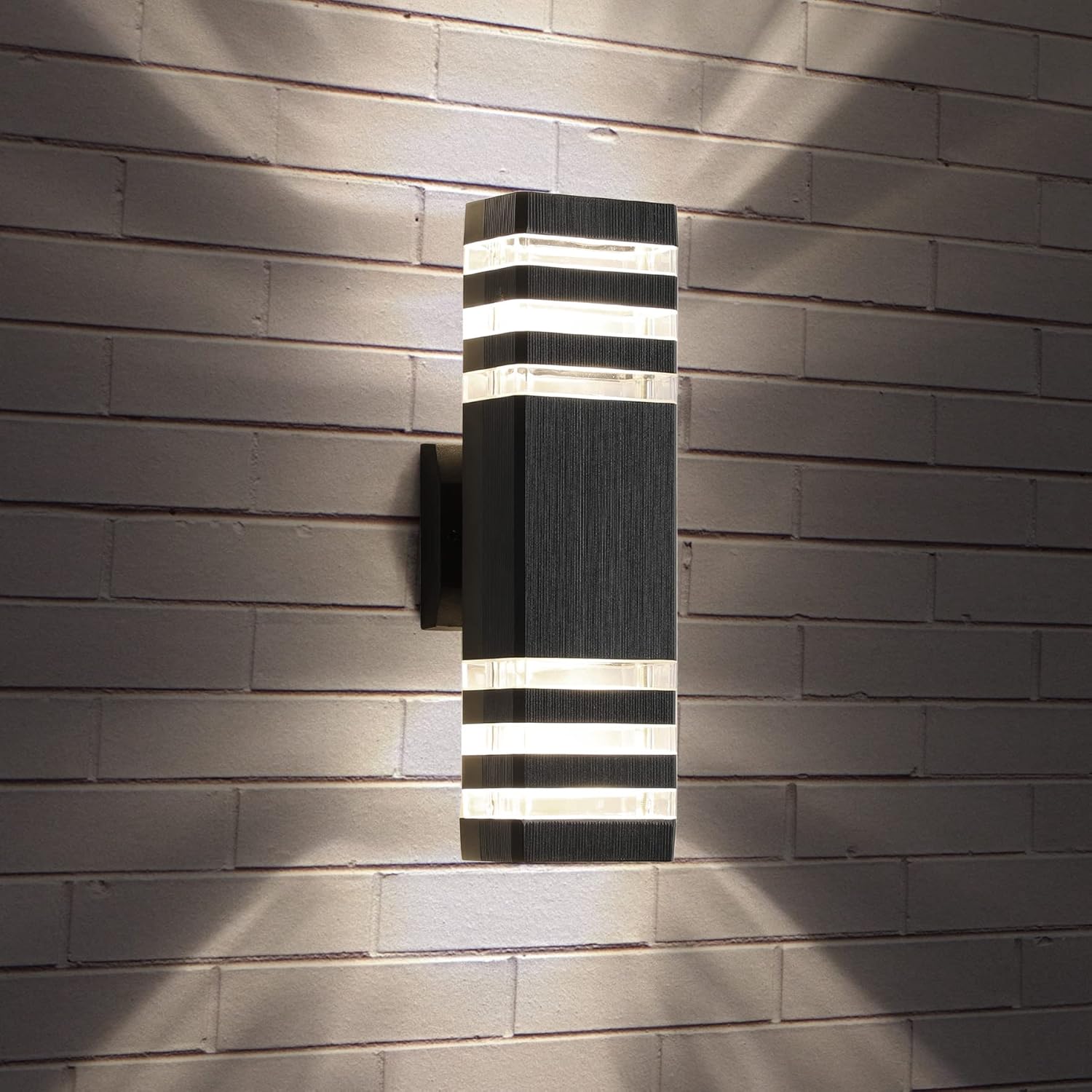 Modern outdoor wall light fixture on a brick wall